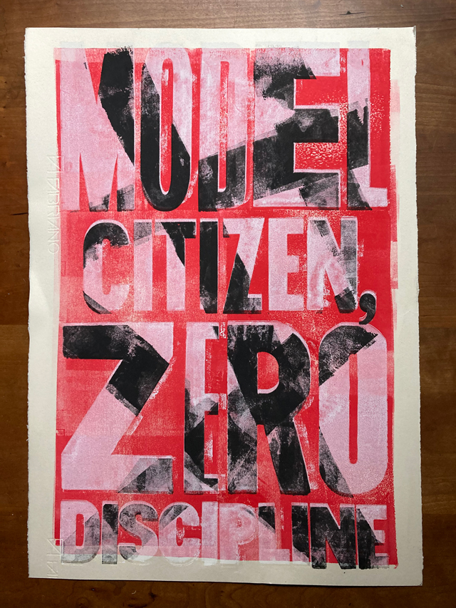 Letterpress print white type on red with  diagonal slashes of black through the type - Model Citizen Zero Discipline.